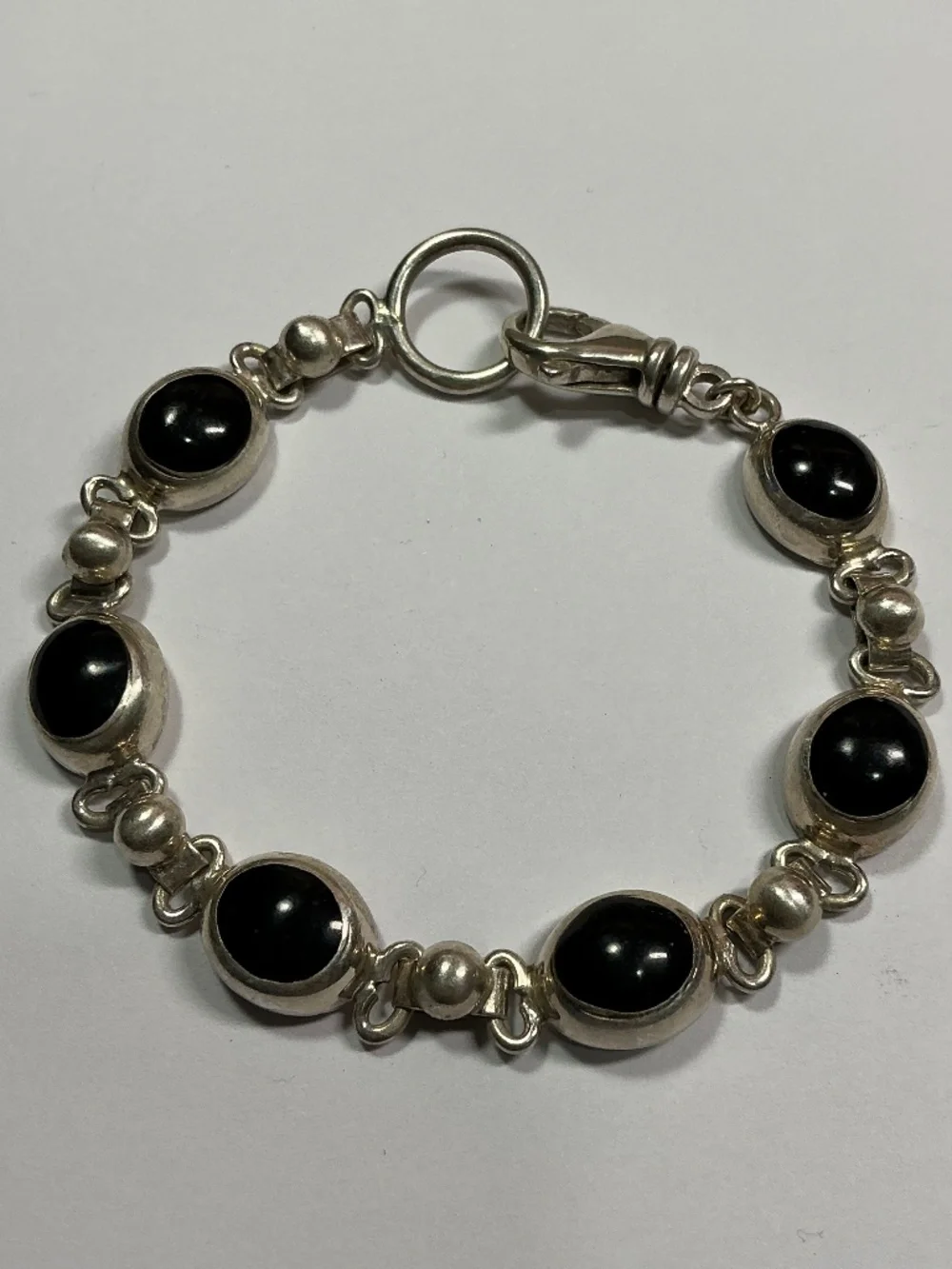Sterling Silver Oval Shaped Black Onyx Link Bracelet. 7 inches long